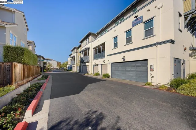 a view of a street with house on both side