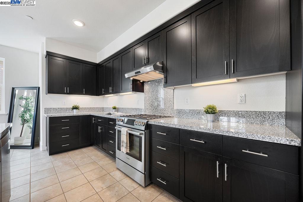 2729 Fifth Street Alameda, CA 94501 - Photo 2 of 19 a kitchen with stainless steel appliances granite countertop a sink stove and oven