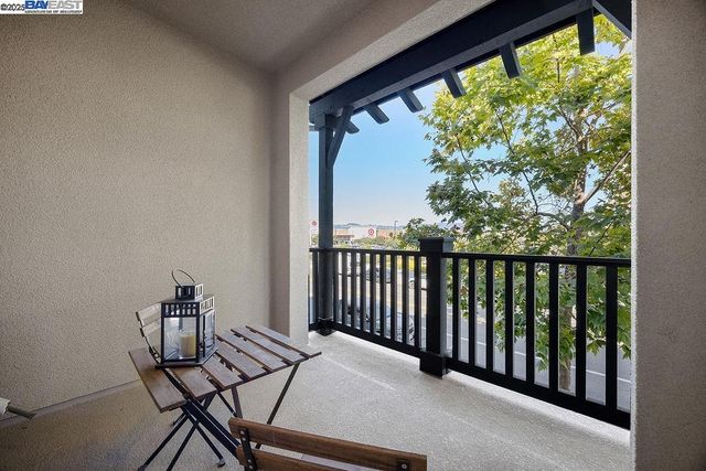 a view of a balcony with chairs