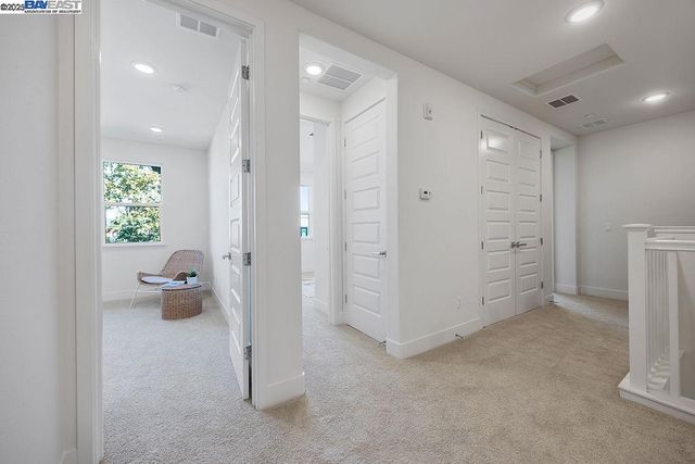 a view of an empty room and workspace