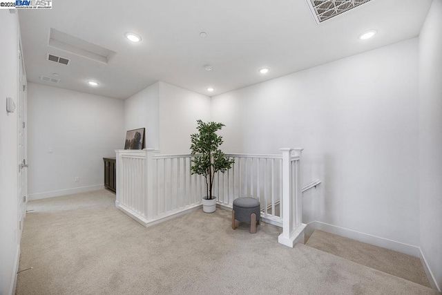 a view of a hallway with a room