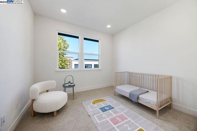 a bedroom with furniture and a window