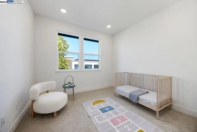 a bedroom with furniture and a window