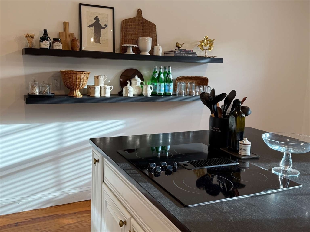 105 Elm Street, Unit A Andover, MA 01810 - Photo 15 of 40 a kitchen with a stove and cabinets
