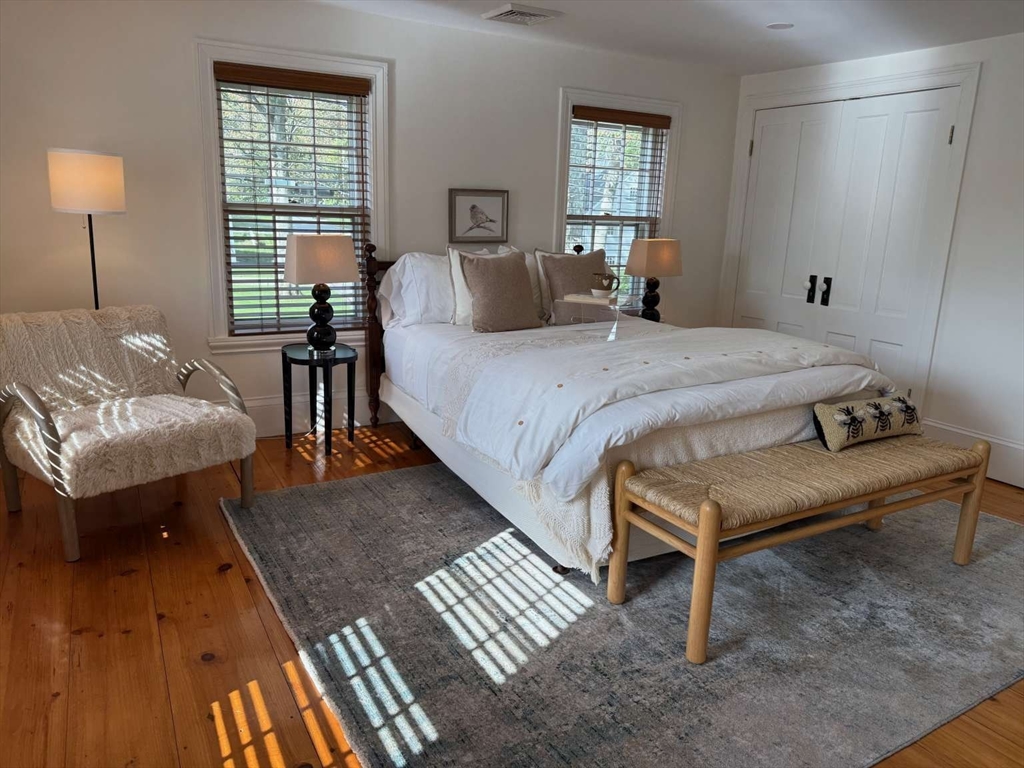 105 Elm Street, Unit A Andover, MA 01810 - Photo 26 of 40 a bedroom with a bed and a couch