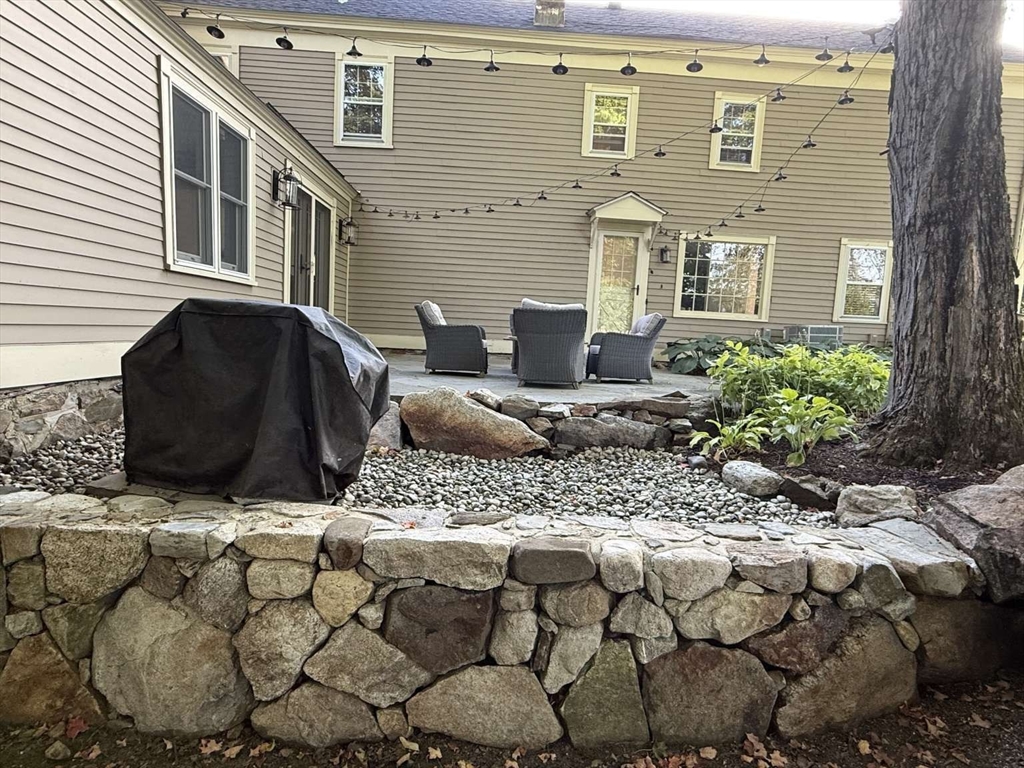 105 Elm Street, Unit A Andover, MA 01810 - Photo 35 of 40 a front view of a house with a yard