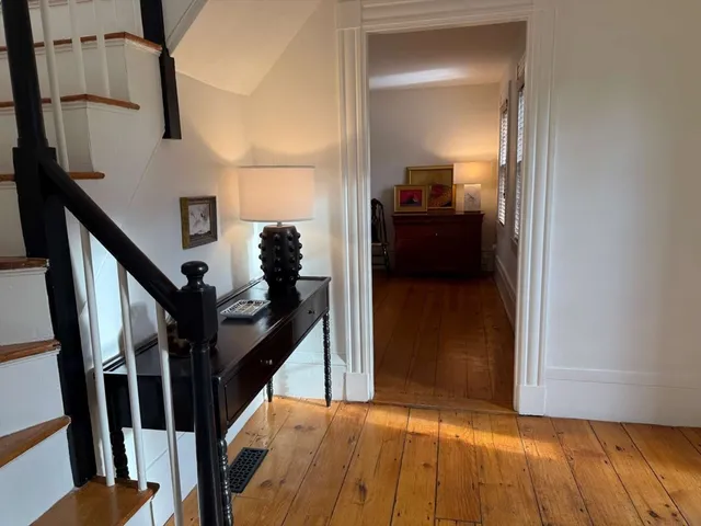 a living room with furniture rug and window