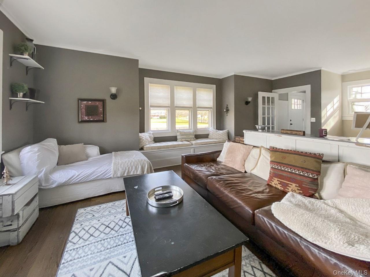 2490 Pike Street Mattituck, NY 11952 - Photo 7 of 15 Living room featuring crown molding and wood finished floors