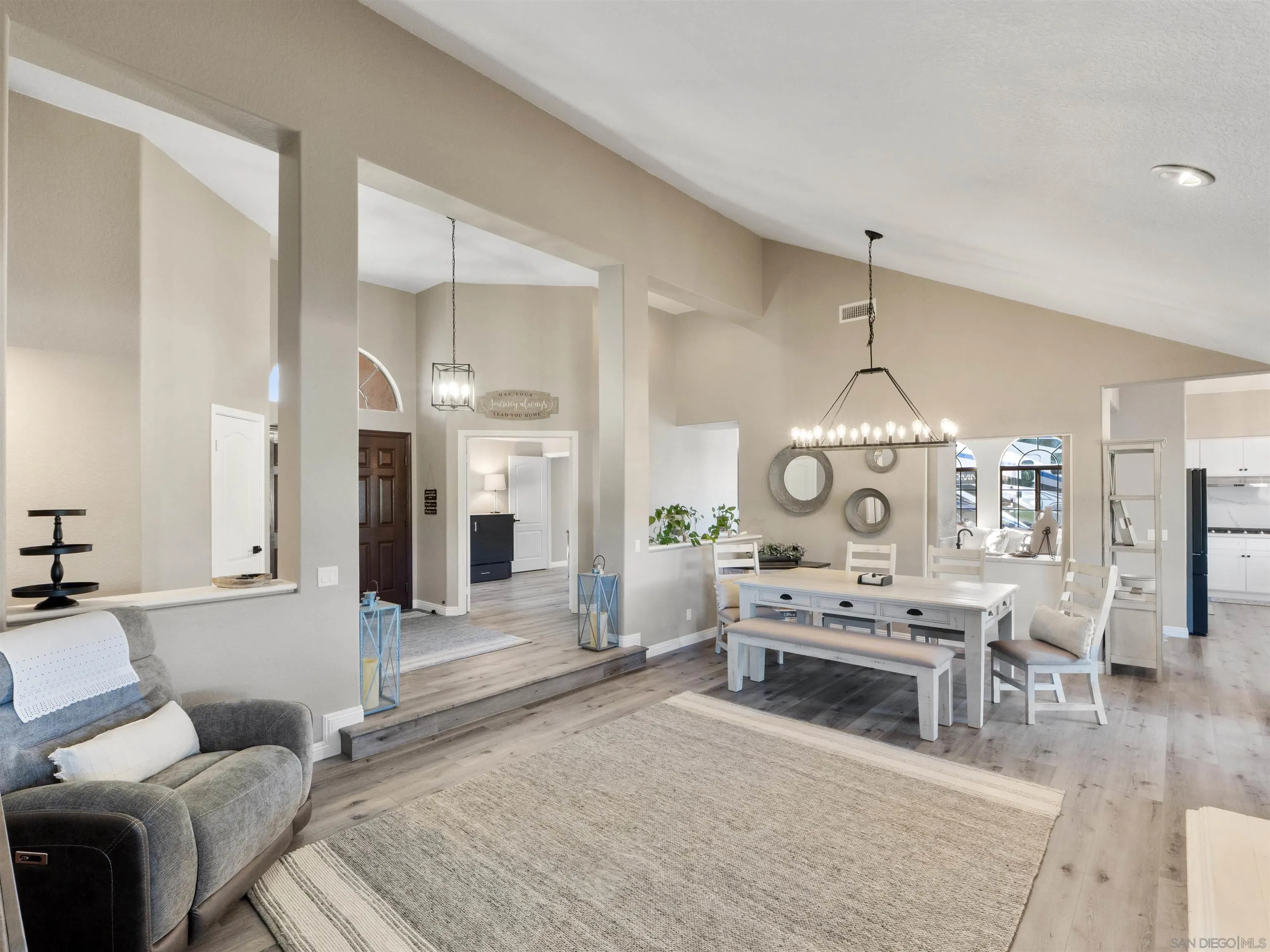 475 Summerhill Terrace Alpine, CA 91901 - Photo 5 of 24 a living room with furniture a fireplace and a chandelier