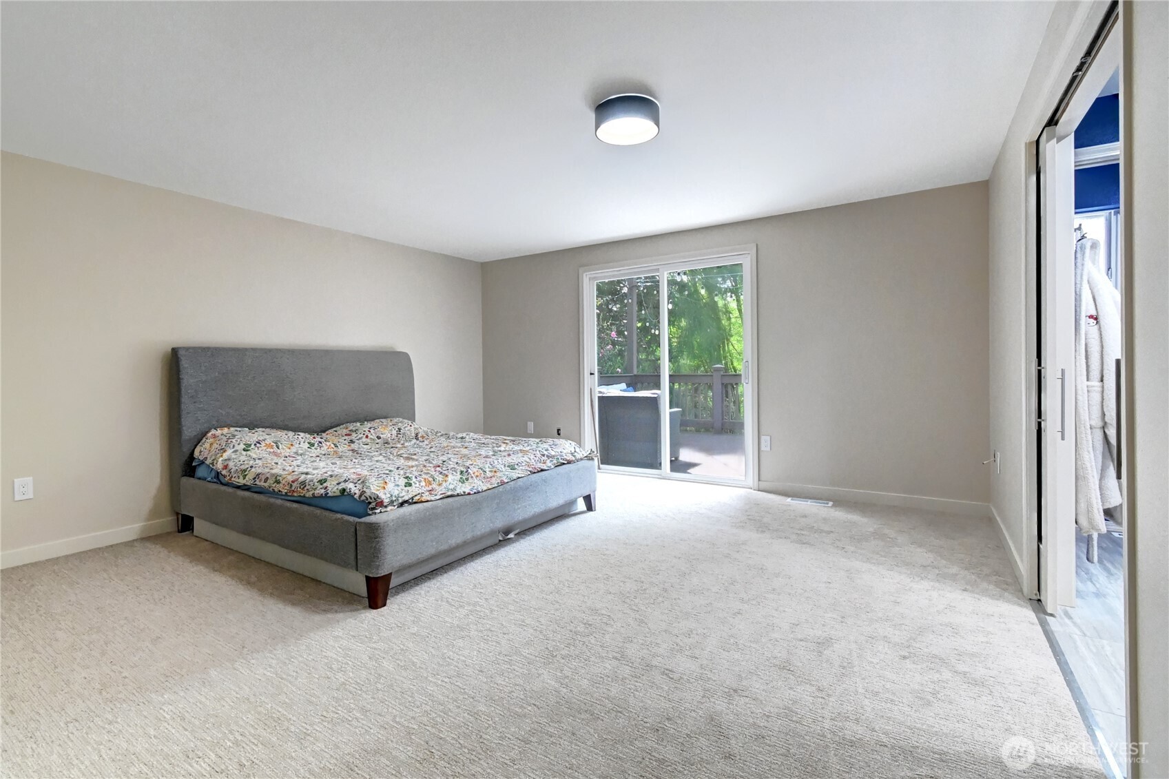 28539 Northeast Tolt Hill Road Carnation, WA 98014 - Photo 19 of 36 a bedroom with a bed lamp and window