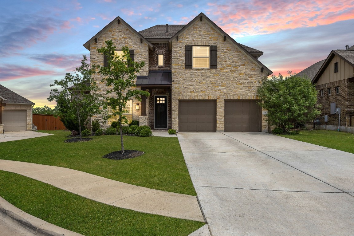 a front view of a house with a yard