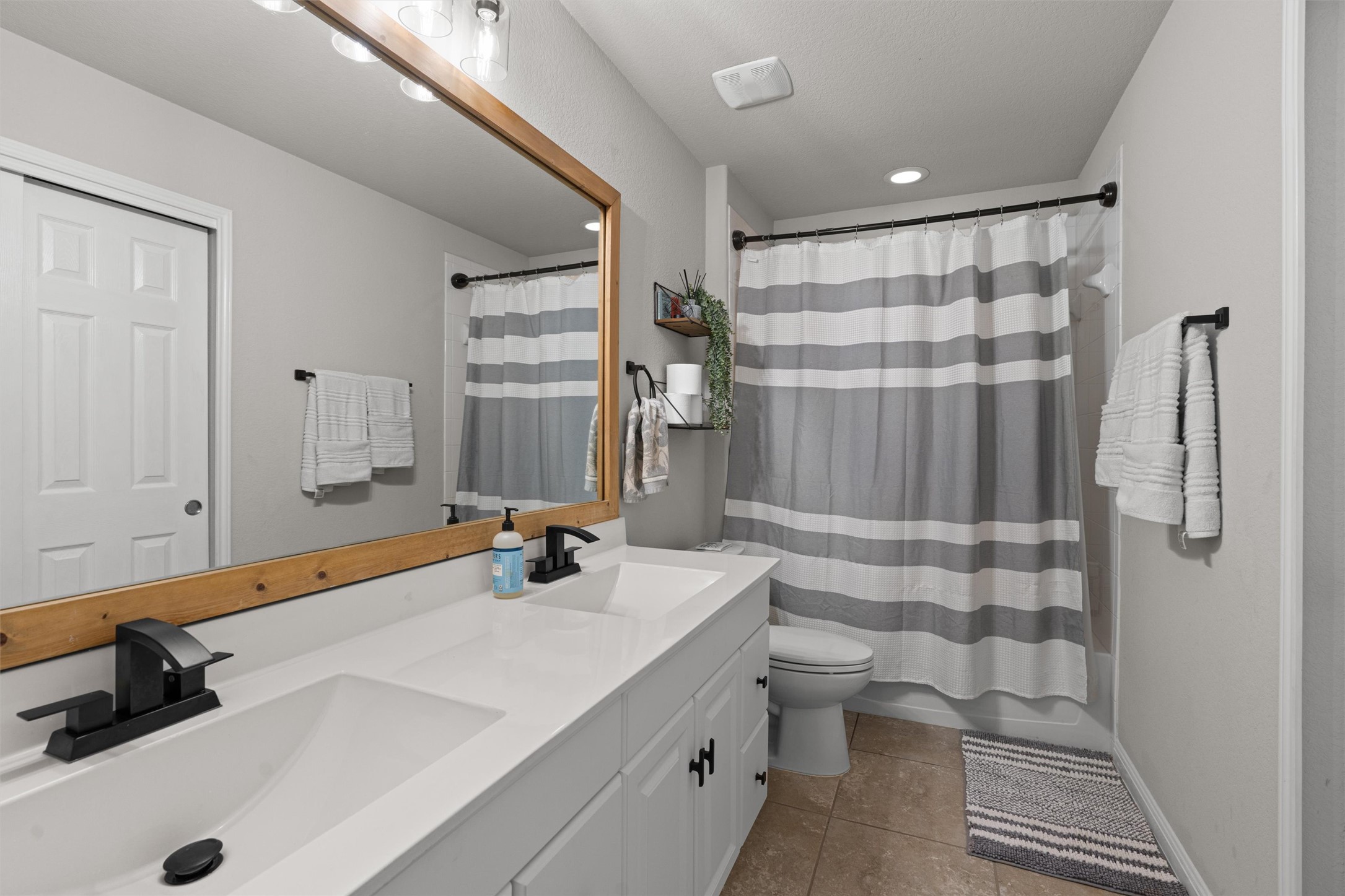 524 Longhorn Cavern Road Leander, TX 78641 - Photo 21 of 34 Bathroom with double vanity, shower / bathtub