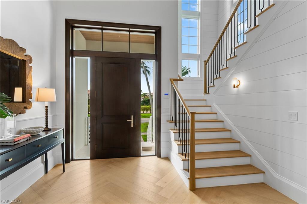 835 11th Avenue South Naples, FL 34102 - Photo 3 of 31 a view of entryway and hall with wooden floor
