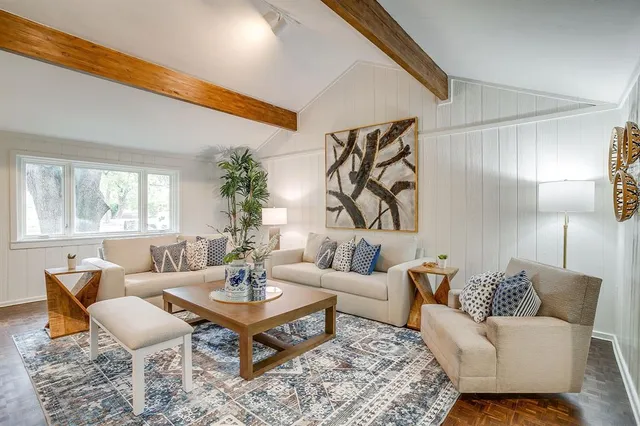 a living room with furniture and a table