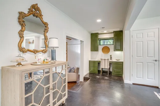 a view of a dining room with furniture and a chandelier
