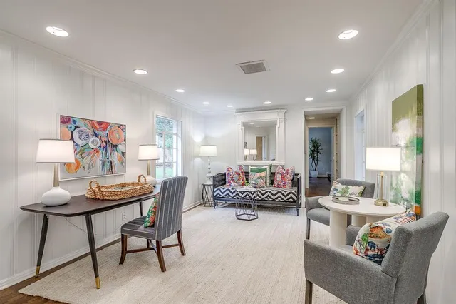 a living room with furniture and a table