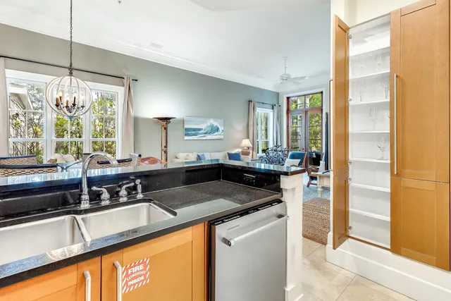a kitchen with granite countertop a sink and a counter top space