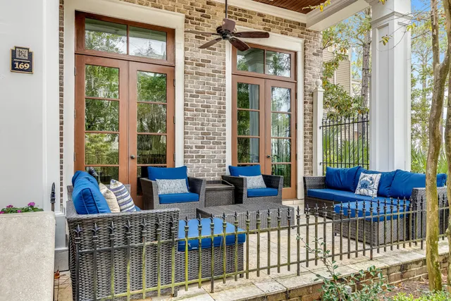 a living room with furniture tv and a window