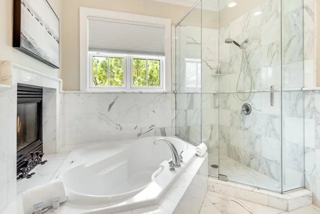 a bathroom with a shower and a sink