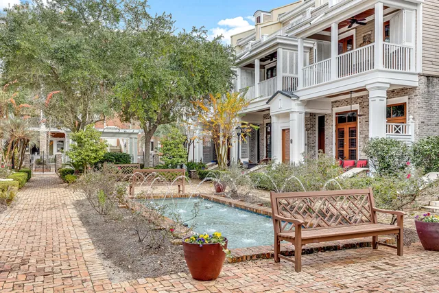 a view of a pathway with a wrought fence