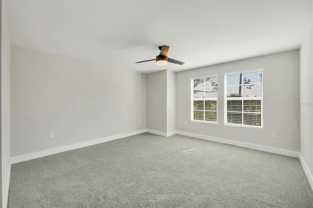 a large bathroom with a granite countertop sink a shower and a mirror