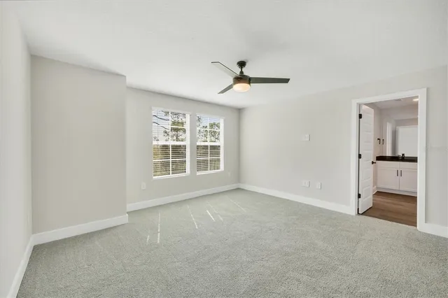 a view of an empty room with a window