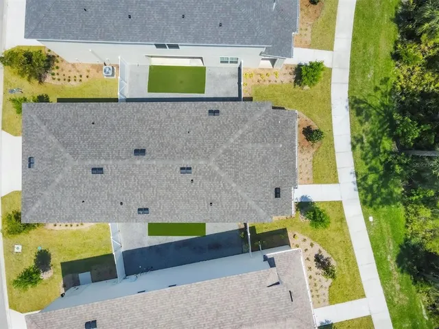 a sign board with buildings in the background