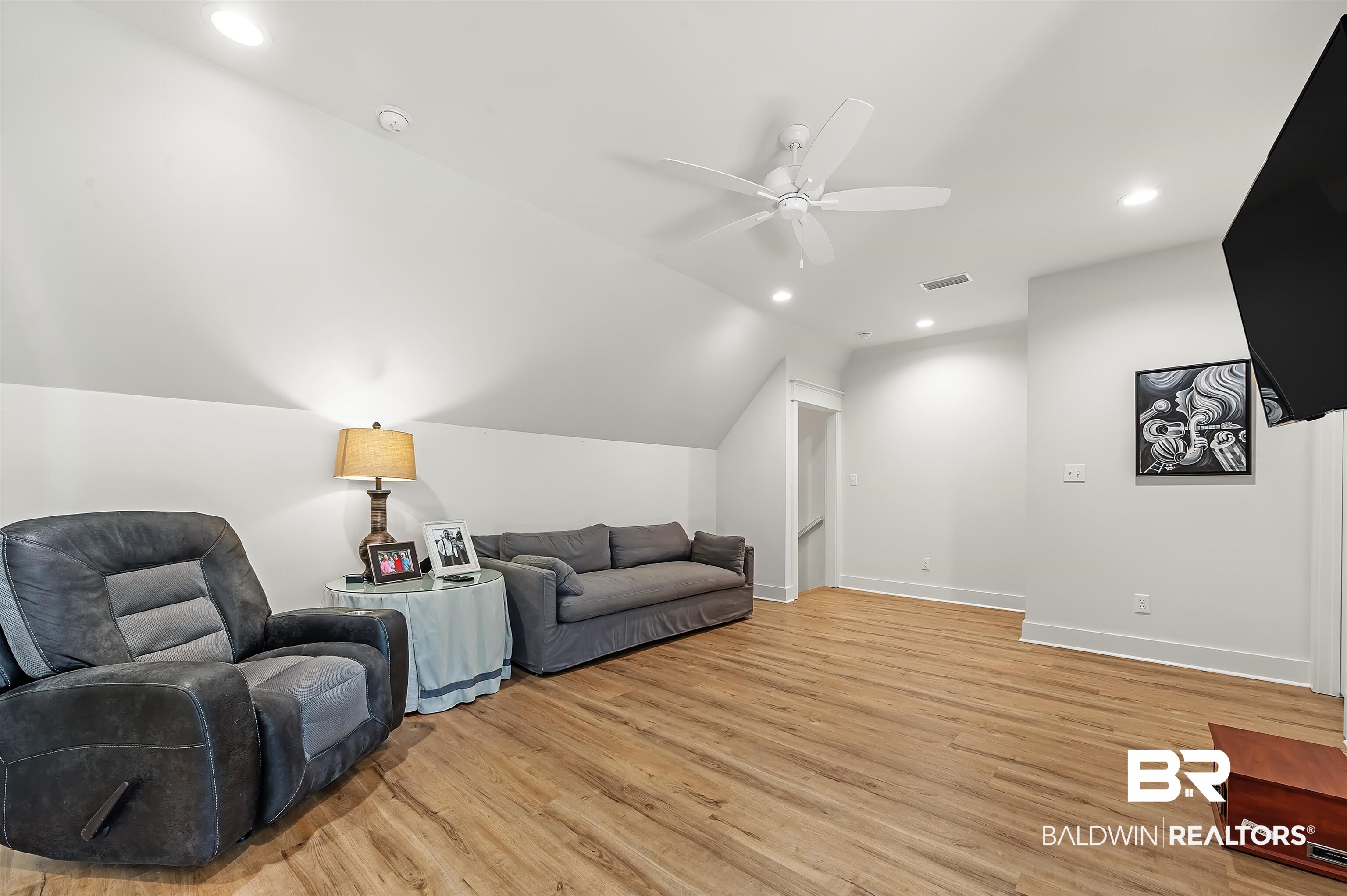 27888 Oakachoy Loop Daphne, AL 36526 - Photo 44 of 65 Living area featuring ceiling fan, vaulted ceiling, recessed lighting, and light wood finished floors