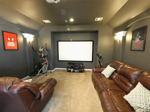 a bed room with a bed and a flat screen tv