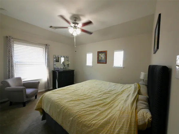 a bedroom with a bed and furniture
