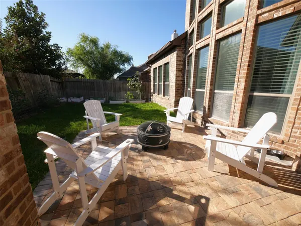 a view of swimming pool with outdoor seating