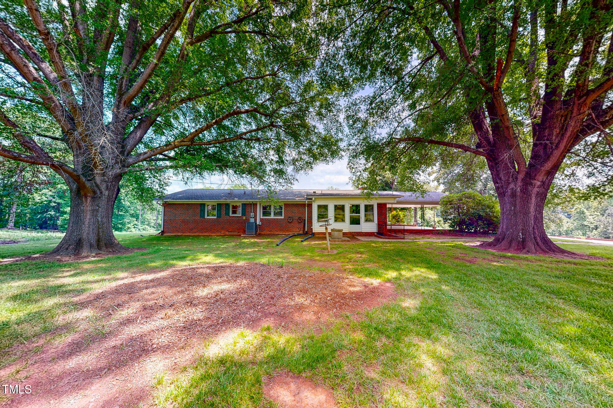 9455 Boston Road Roxboro, NC 27574 - Photo 14 of 42 a view of a house with backyard and sitting area