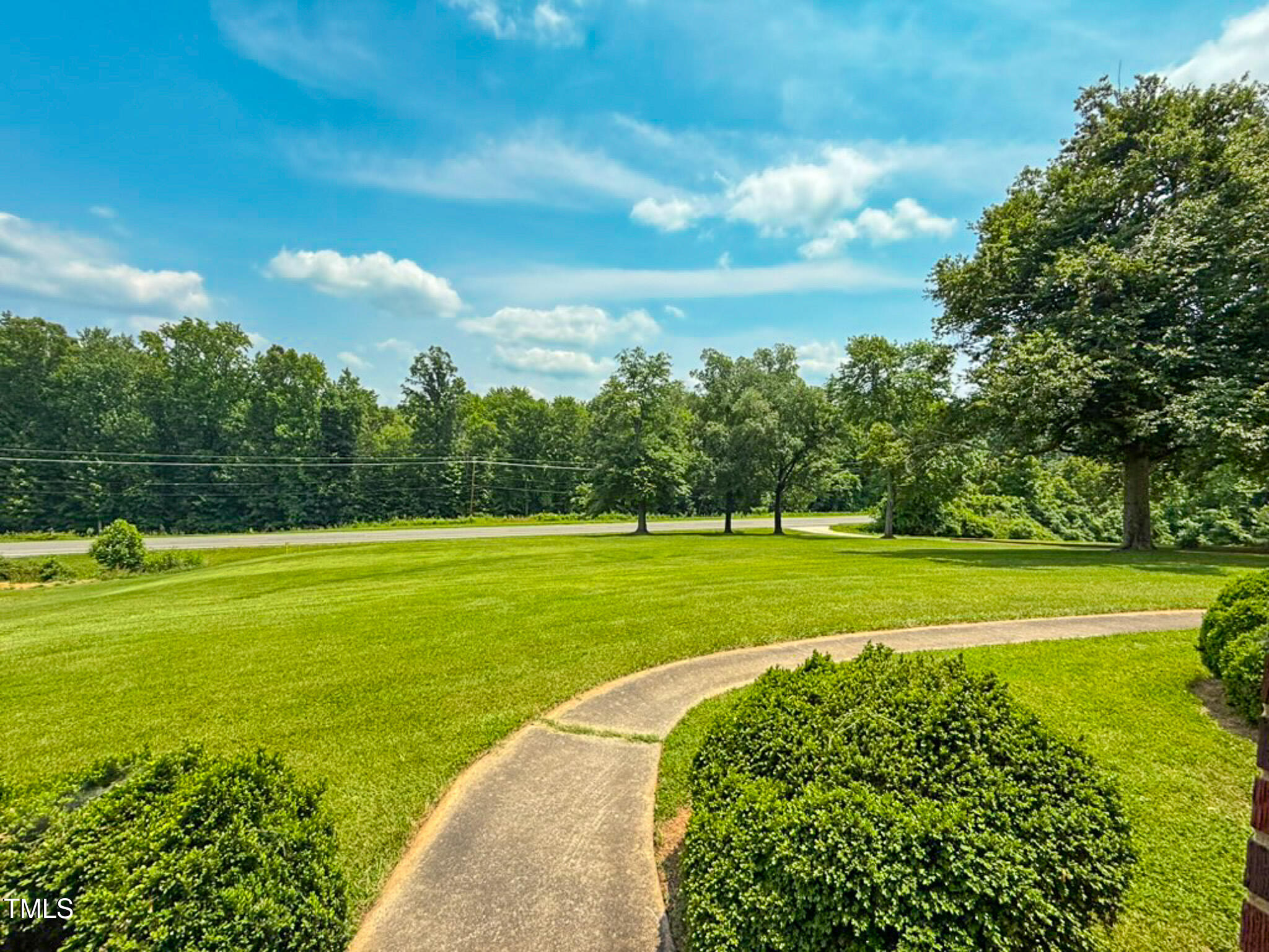9455 Boston Road Roxboro, NC 27574 - Photo 17 of 42 a view of a green field with clear sky