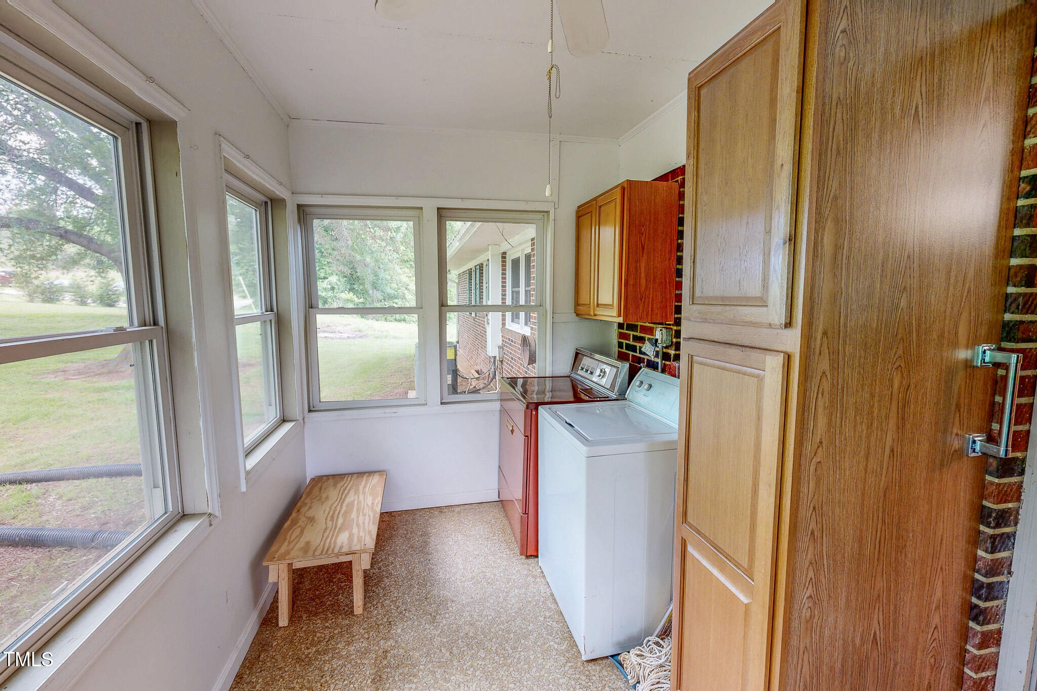 9455 Boston Road Roxboro, NC 27574 - Photo 19 of 42 a bathroom with sink a mirror and a bathtub
