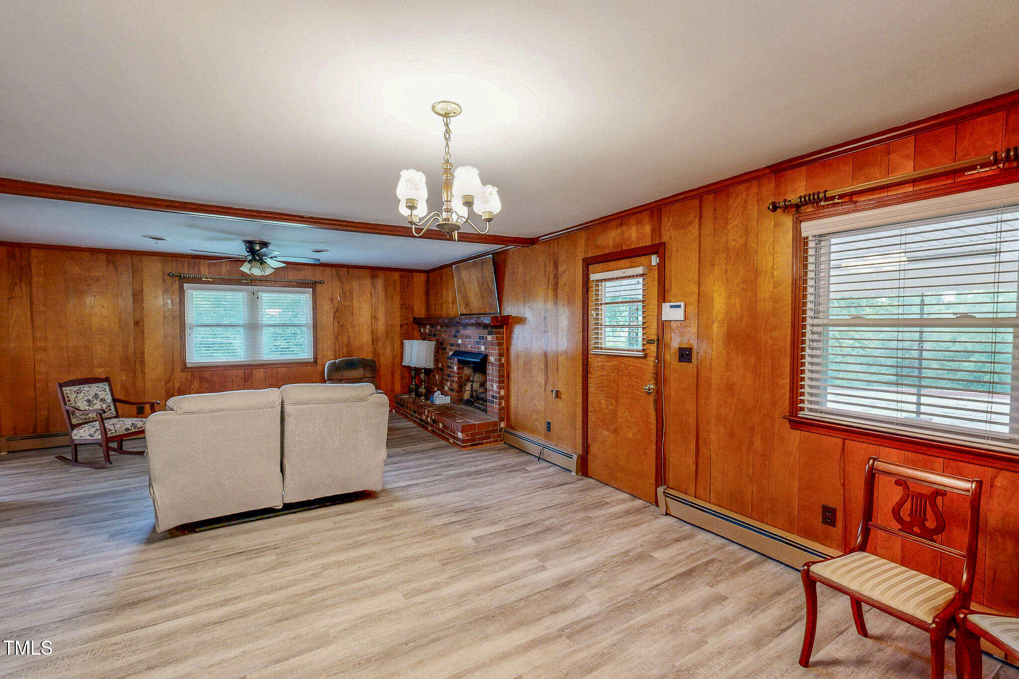 9455 Boston Road Roxboro, NC 27574 - Photo 21 of 42 a living room with furniture and a chandelier