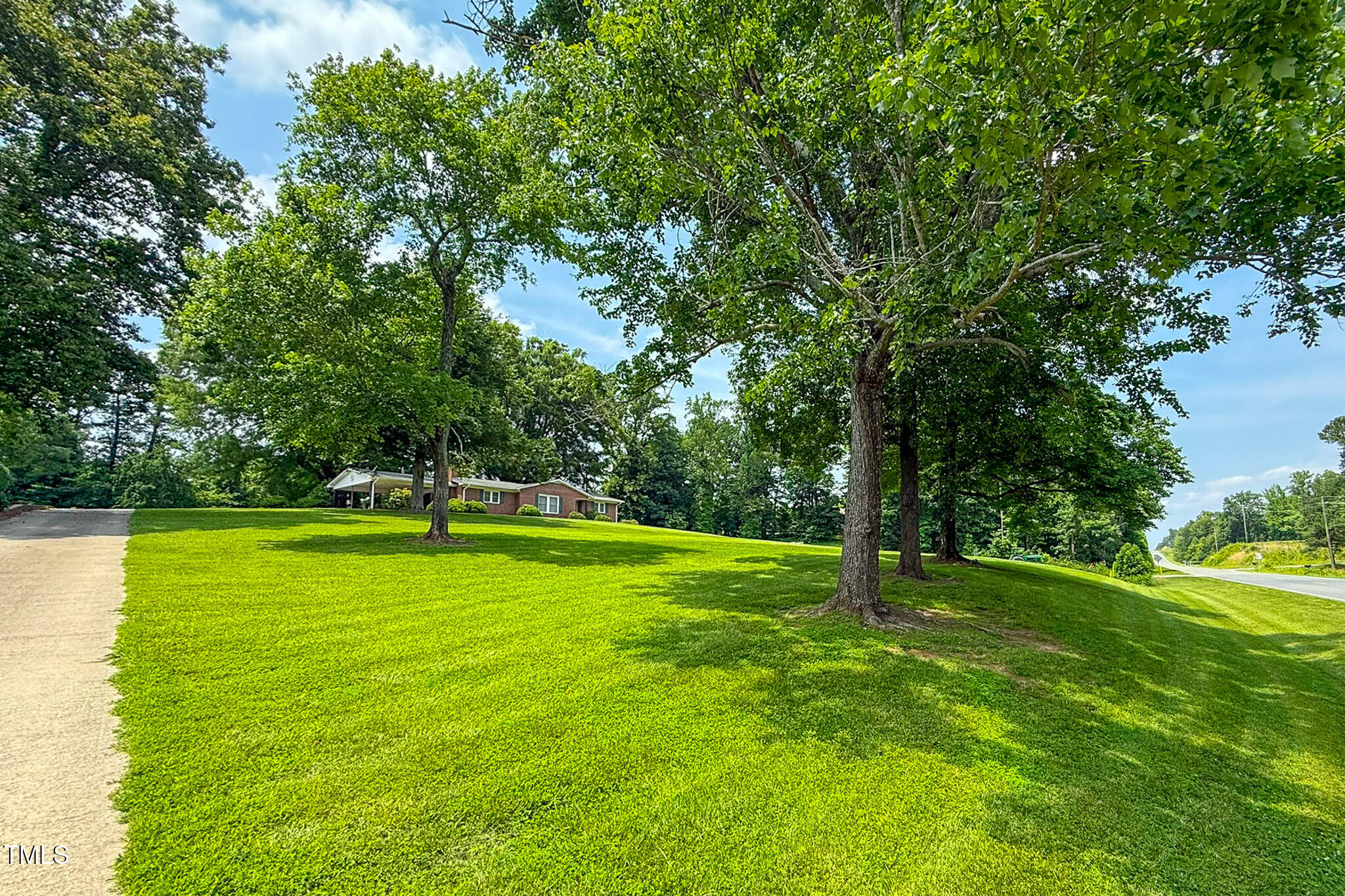 9455 Boston Road Roxboro, NC 27574 - Photo 25 of 42 a view of a big yard with swimming pool