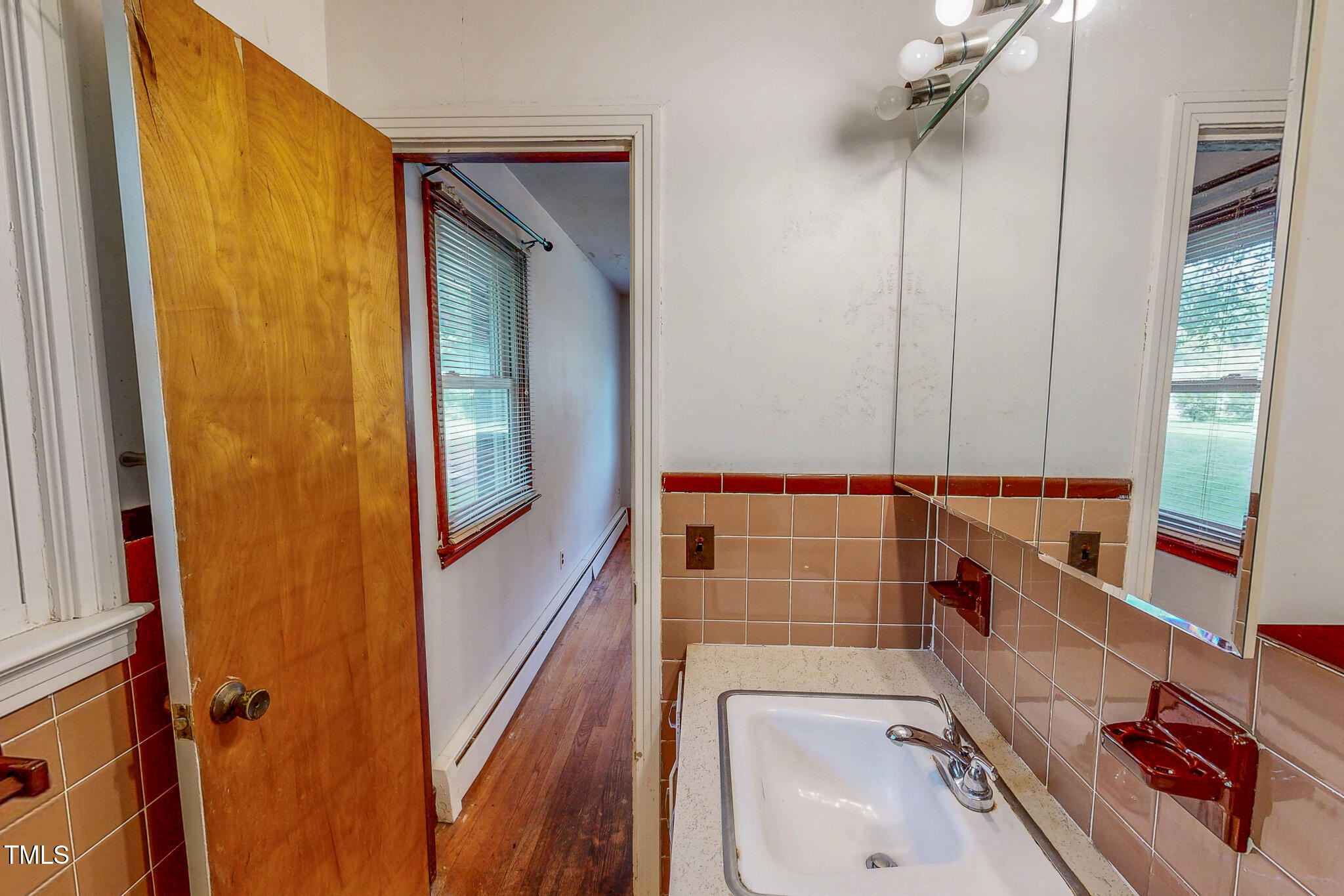 9455 Boston Road Roxboro, NC 27574 - Photo 29 of 42 a bathroom with a sink a toilet and shower