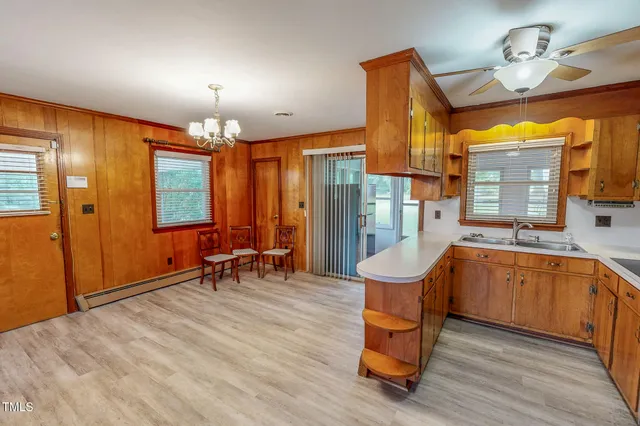 a room with lots of furniture and windows