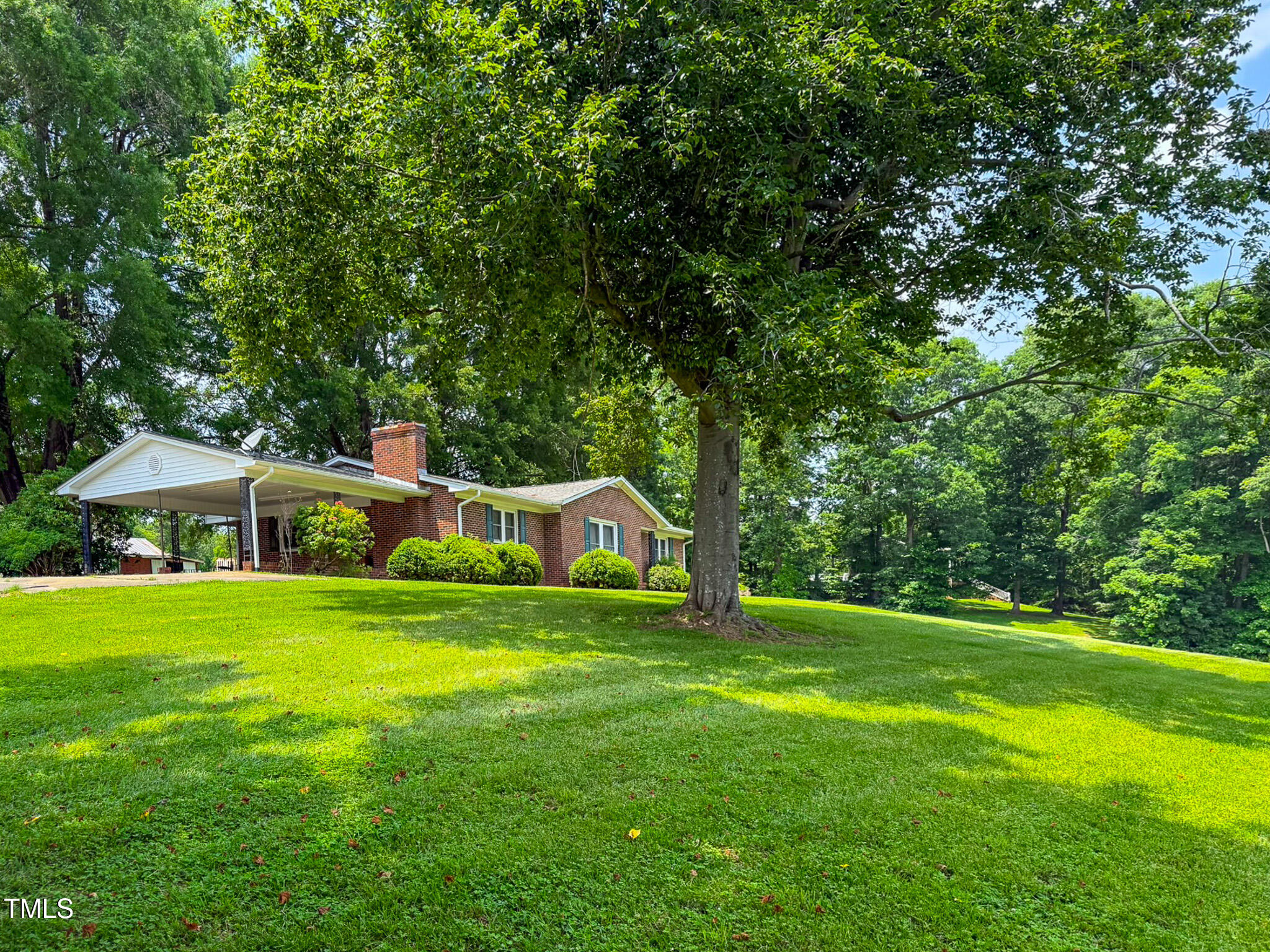9455 Boston Road Roxboro, NC 27574 - Photo 5 of 42 a front view of a house with a yard