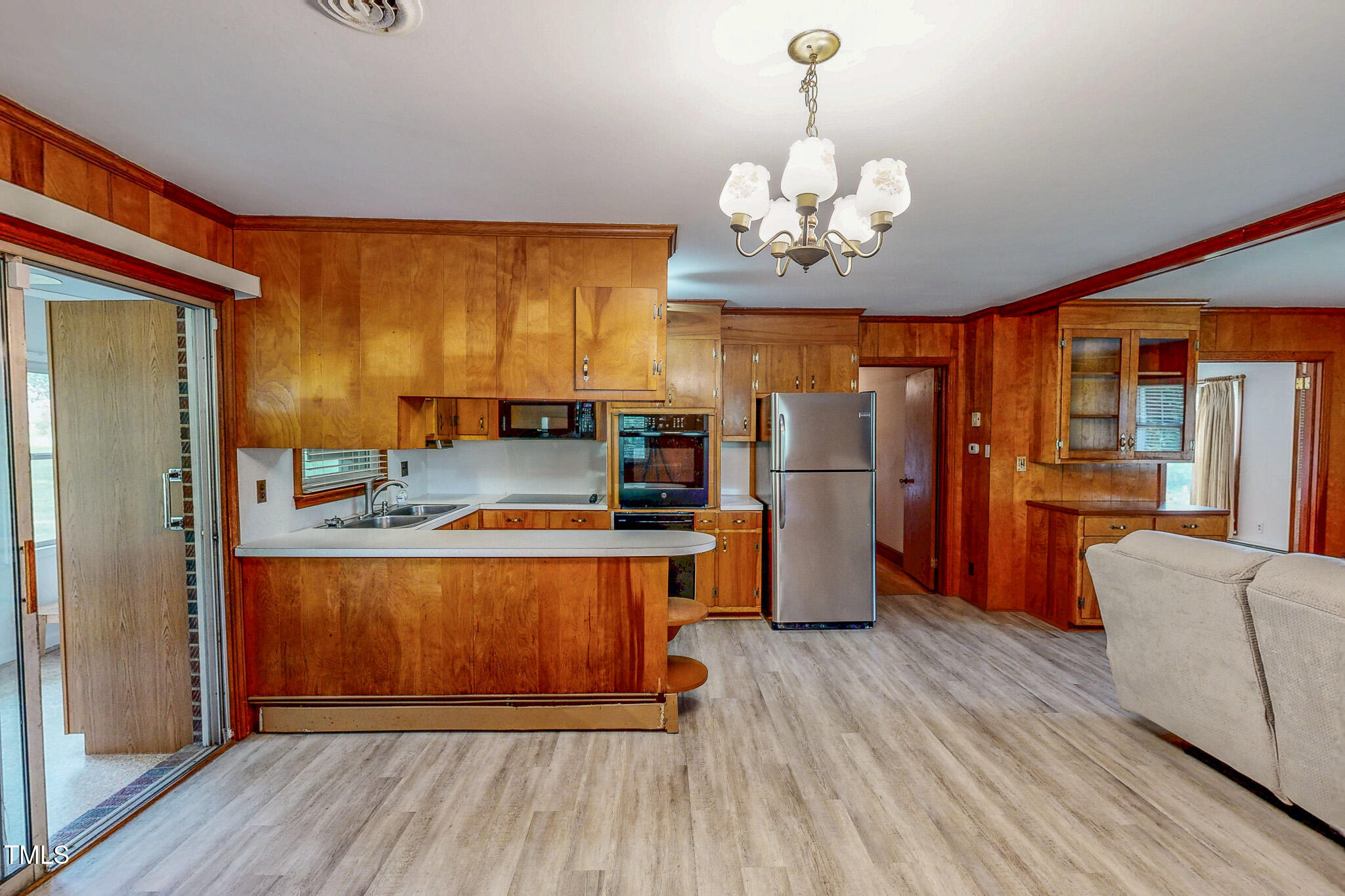 9455 Boston Road Roxboro, NC 27574 - Photo 8 of 42 a kitchen with stainless steel appliances granite countertop a refrigerator a stove top oven a sink dishwasher and wooden floor