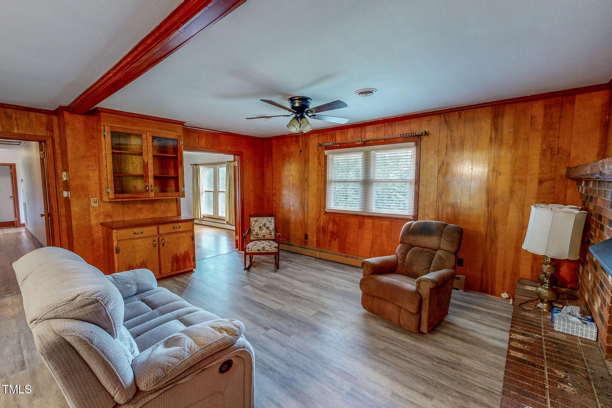9455 Boston Road Roxboro, NC 27574 - Photo 9 of 42 a living room with furniture a ceiling fan and a large window