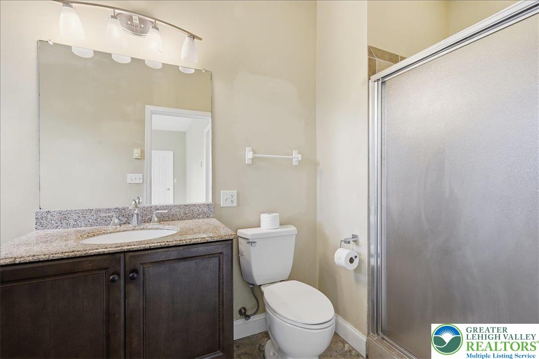 64 Robertson Road Jim Thorpe, PA 18229 - Photo 30 of 54 a bathroom with a granite countertop sink toilet and shower