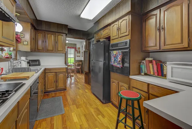 a living room with a couch and a dresser