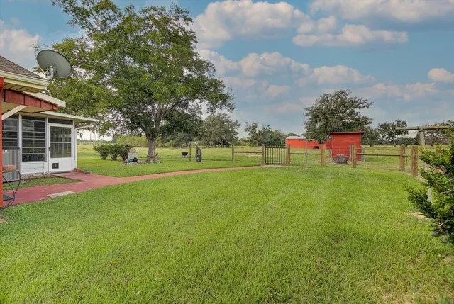 a spacious bathroom with a double vanity sink toilet mirror and shower