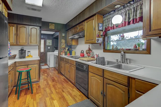 a bathroom with a sink mirror and vanity