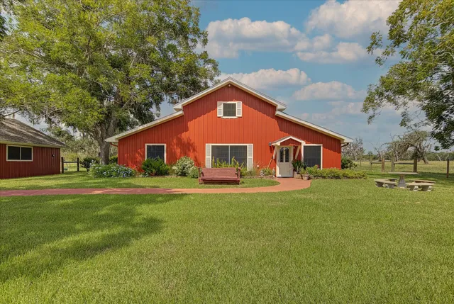 a view of front door with furniture and a window