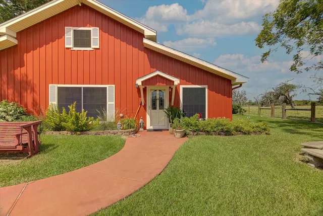 a living room with fireplace furniture and a flat screen tv