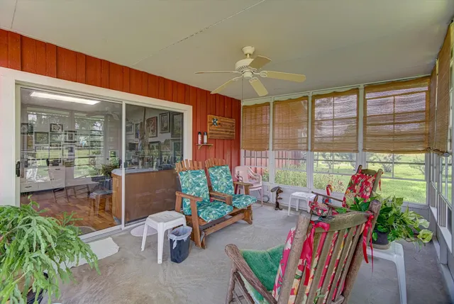 a kitchen with stainless steel appliances granite countertop a sink and a refrigerator