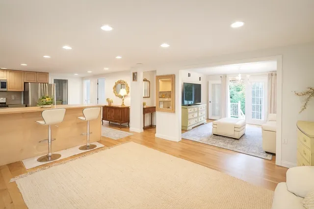 a spacious bedroom with a large bed and a large window