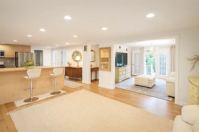 a spacious bedroom with a large bed and a large window